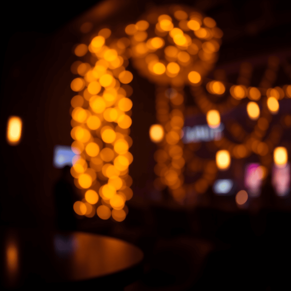 Fondo premium oscuro con luces doradas suaves